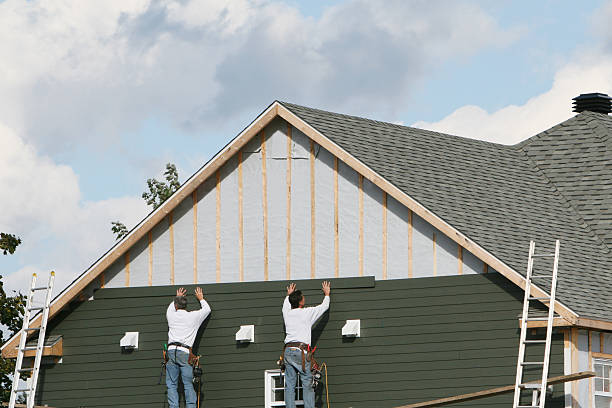 Professional Storm Damage Siding Repair technician working in Sidman, PA